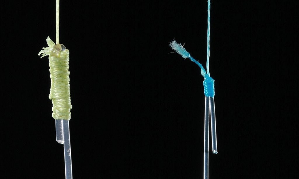 A pair of Albright knots connecting braided fishing line to leader